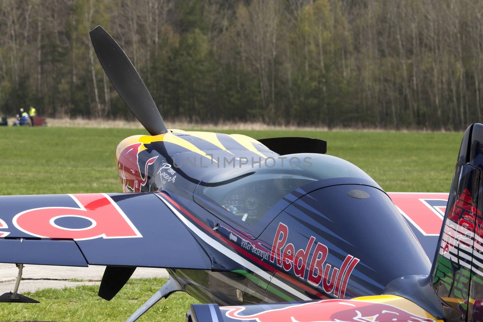 Plasy, Czech Republic - April 27, 2013: Peter Besenyei from Hungary on the Airshow "The Day on Air". His aircraft is painted in the colors of Red Bull energy drink for sponsorship reasons