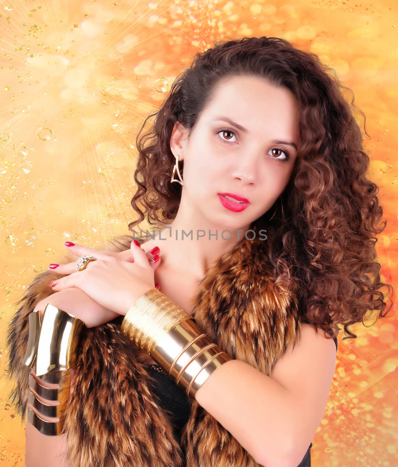 young girl with curly hair in a fur coat on an abstract background