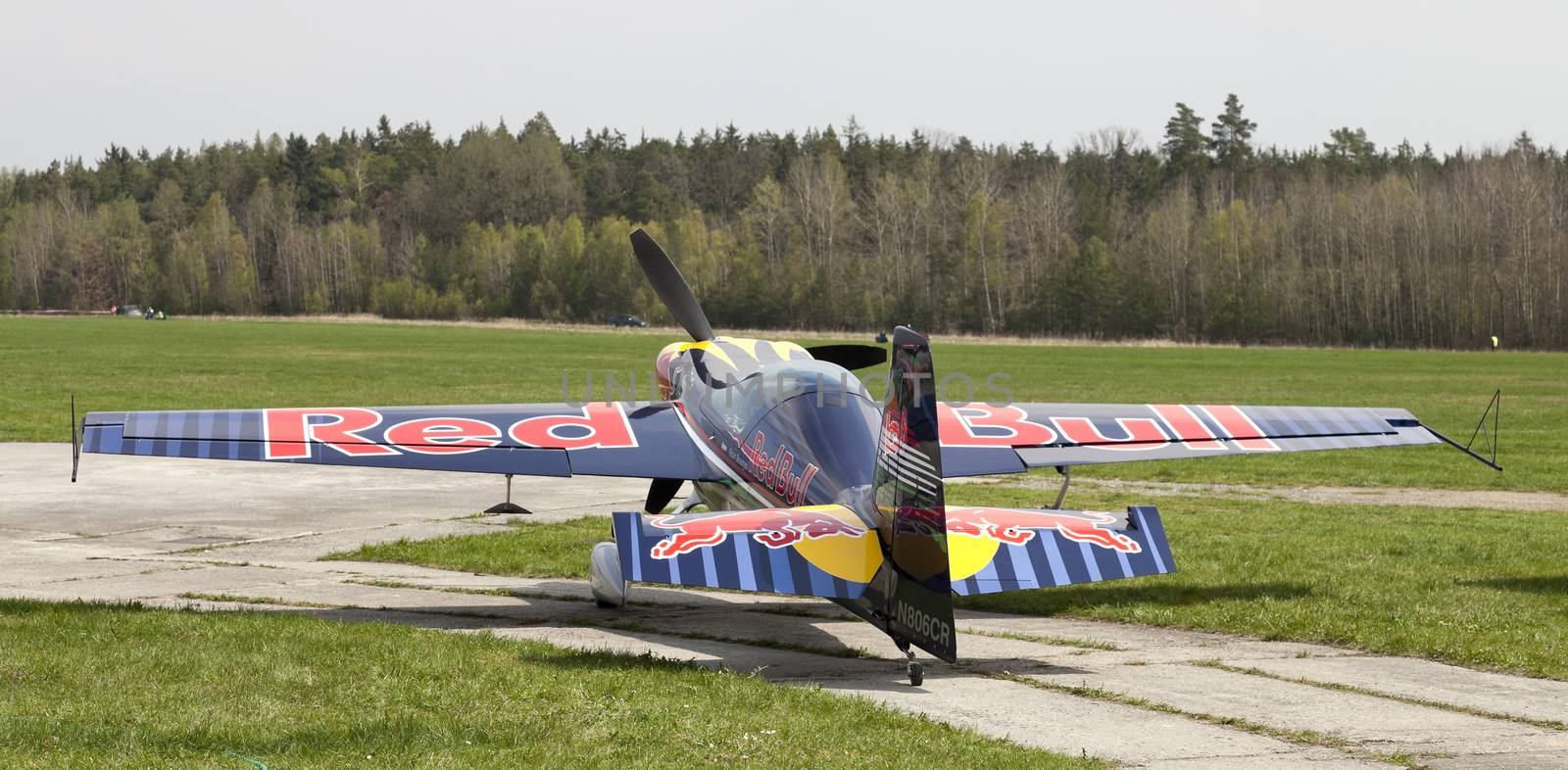 Plasy, Czech Republic - April 27, 2013: Peter Besenyei from Hungary on the Airshow "The Day on Air". His aircraft is painted in the colors of Red Bull energy drink for sponsorship reasons