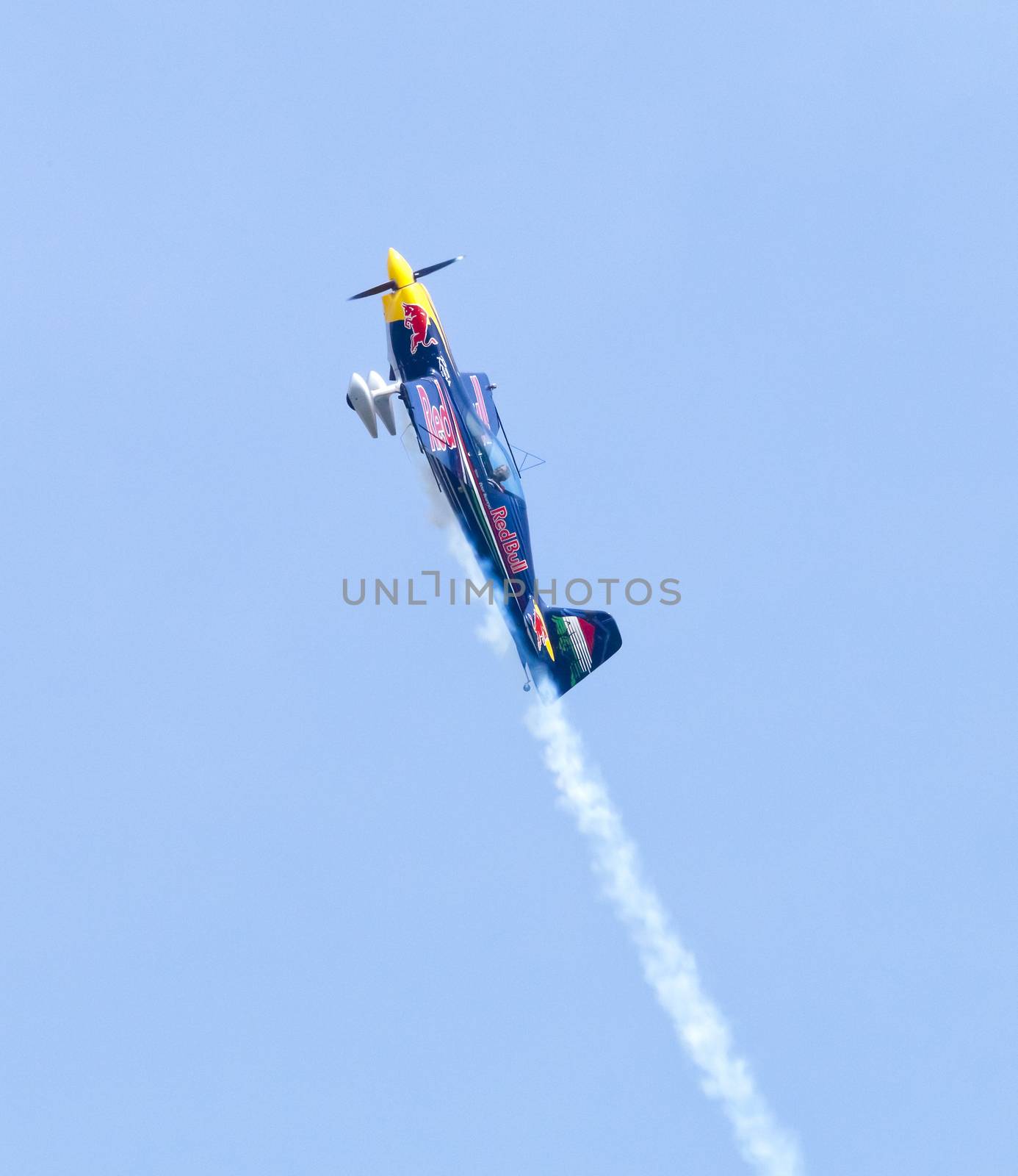 Plasy, Czech Republic - April 27, 2013: Peter Besenyei from Hungary on the Airshow "The Day on Air". His aircraft is painted in the colors of Red Bull energy drink for sponsorship reasons