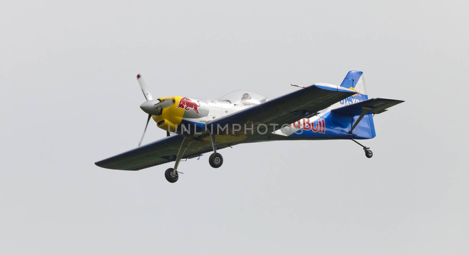 Plasy, Czech Republic - April 27, 2013: The Flying Bulls Aerobatics Team on the Airshow "The Day on Air". The team fly four modified Zlin Z-50 LX aircraft, painted in the colors of Red Bull energy drink for sponsorship reasons