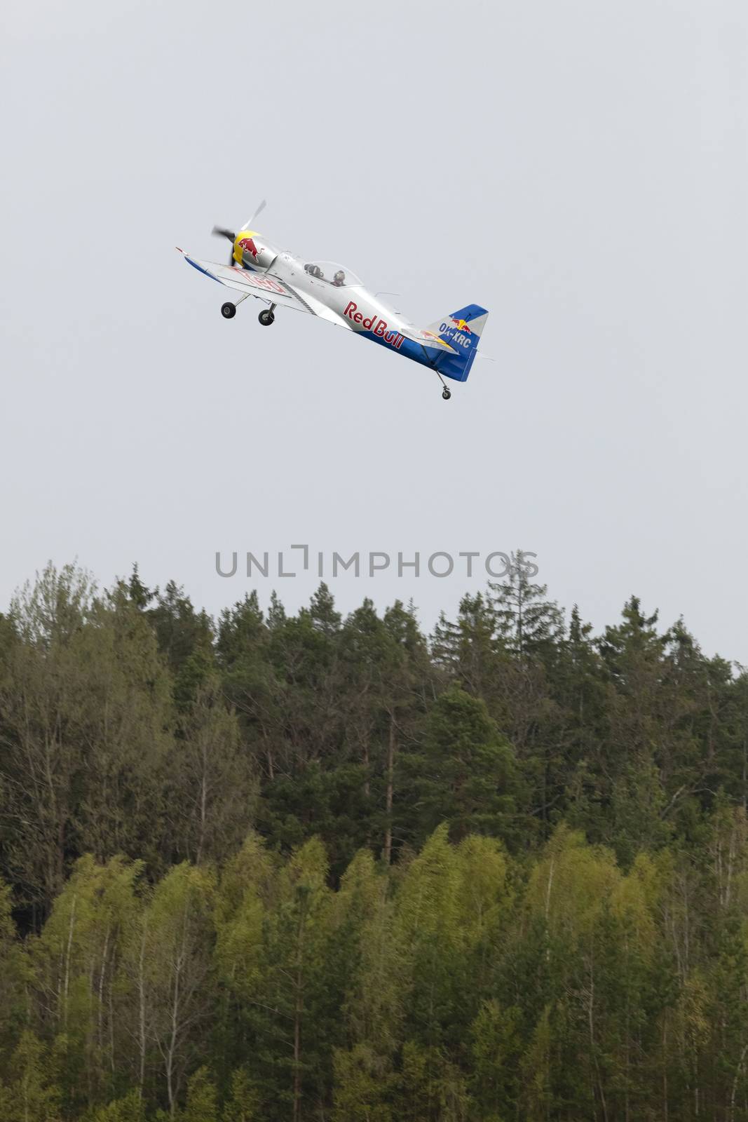 Plasy, Czech Republic - April 27, 2013: The Flying Bulls Aerobatics Team on the Airshow "The Day on Air". The team fly four modified Zlin Z-50 LX aircraft, painted in the colors of Red Bull energy drink for sponsorship reasons