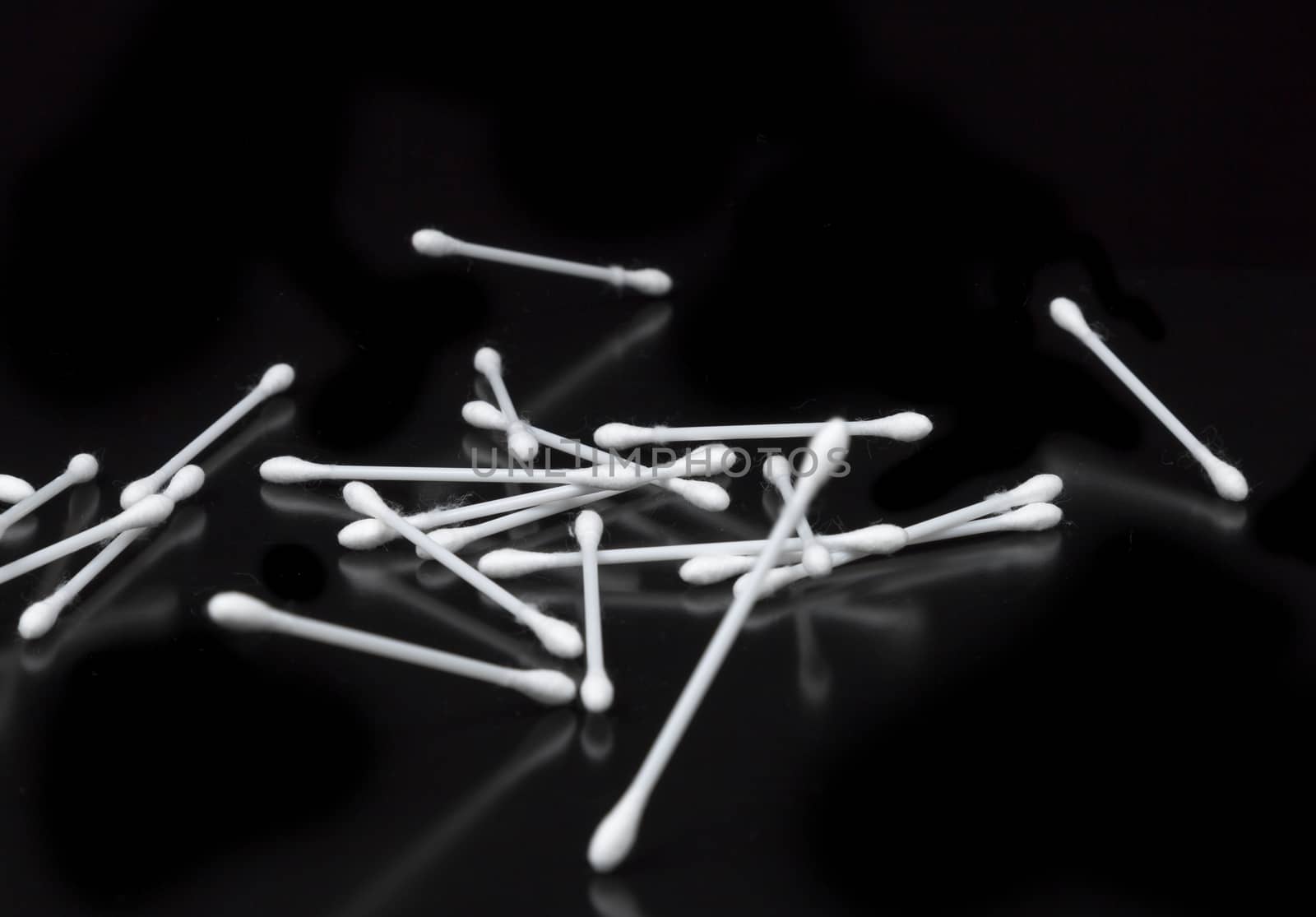 Cotton Swabs on Black Background bouncing.