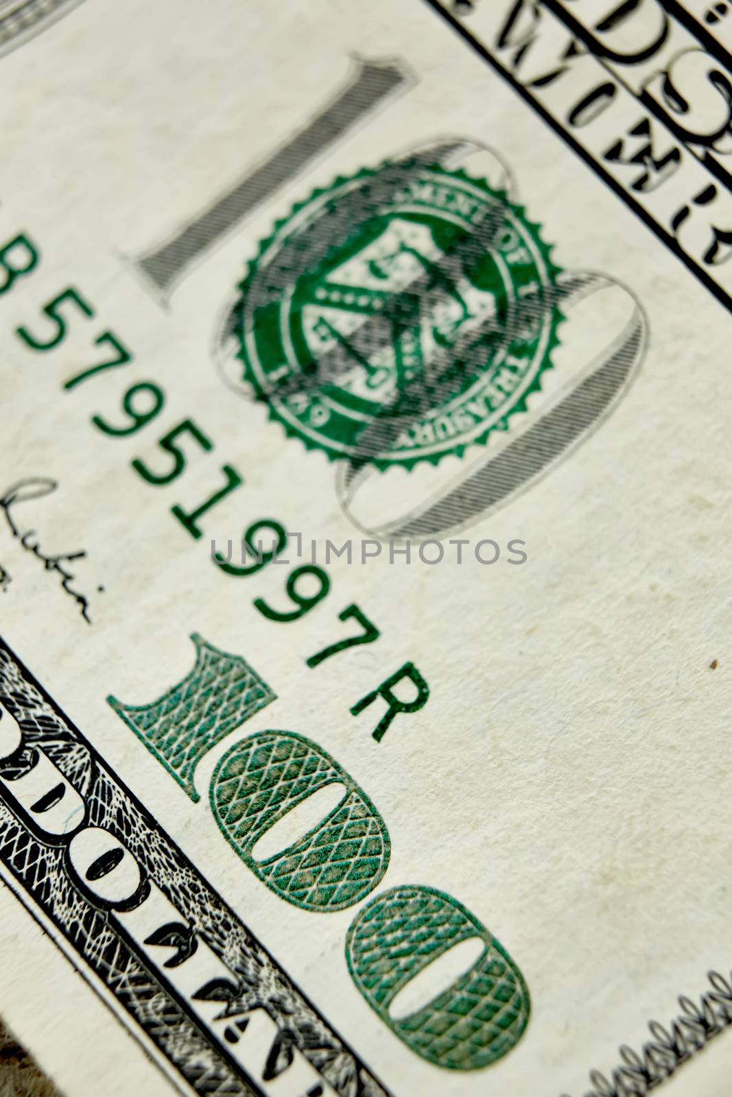 Macro close up of the US 100 dollar bill by sarymsakov