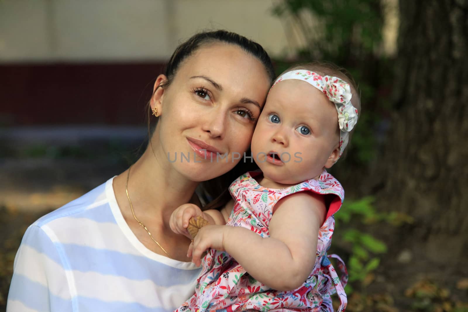 Happy mother and daughter in the park