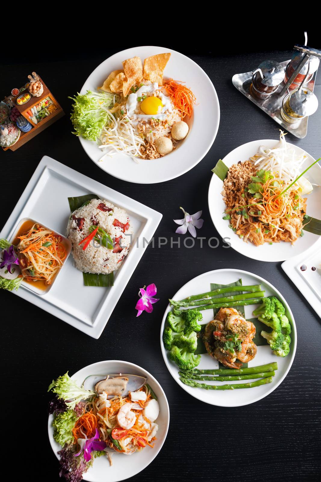 Top down view of a variety of authentic Thai and stir fry dishes.  Shallow depth of field.