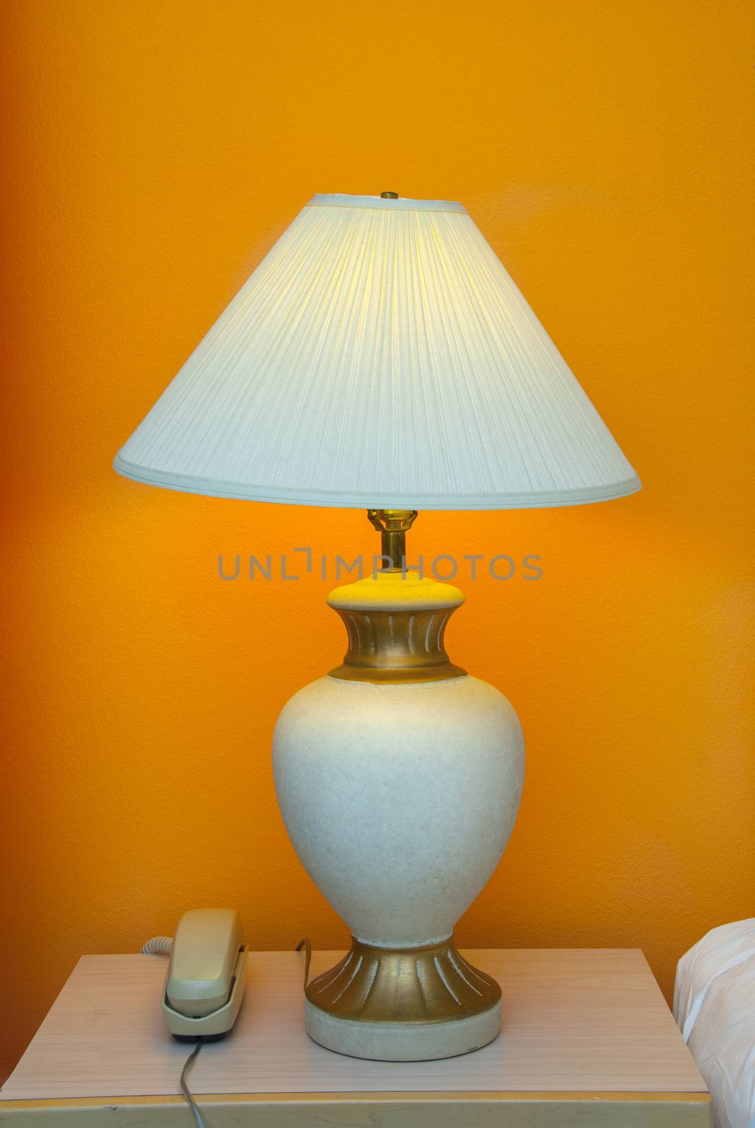 desk lamp and telephone at a hotel room