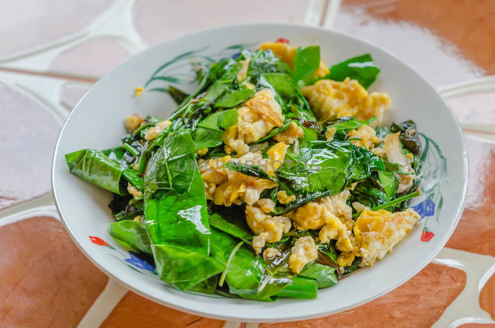 stir fried Gnetum  gnemon or Melinjo  with egg and garlic in oyster sauce