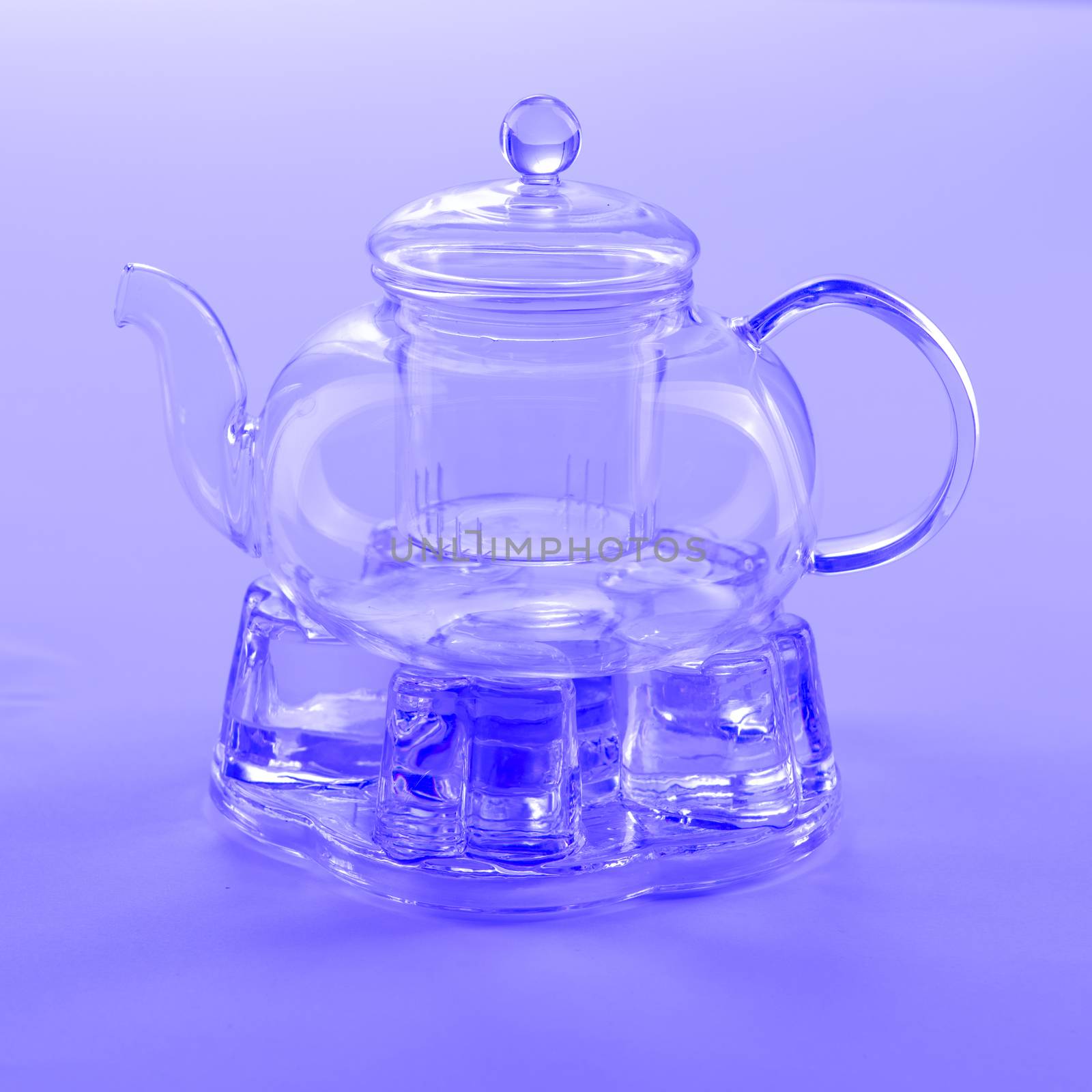 Isolated Tea Pot from glass on the table