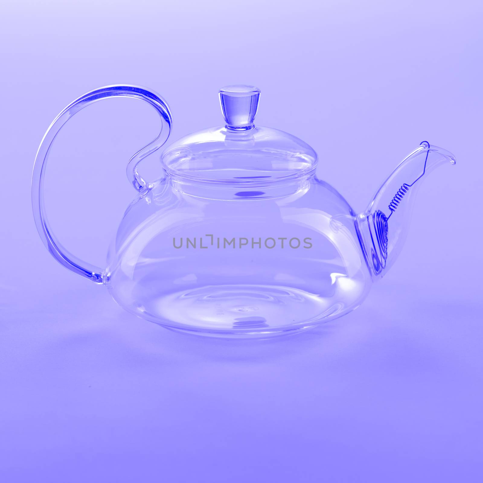 Isolated Tea Pot from glass on the table