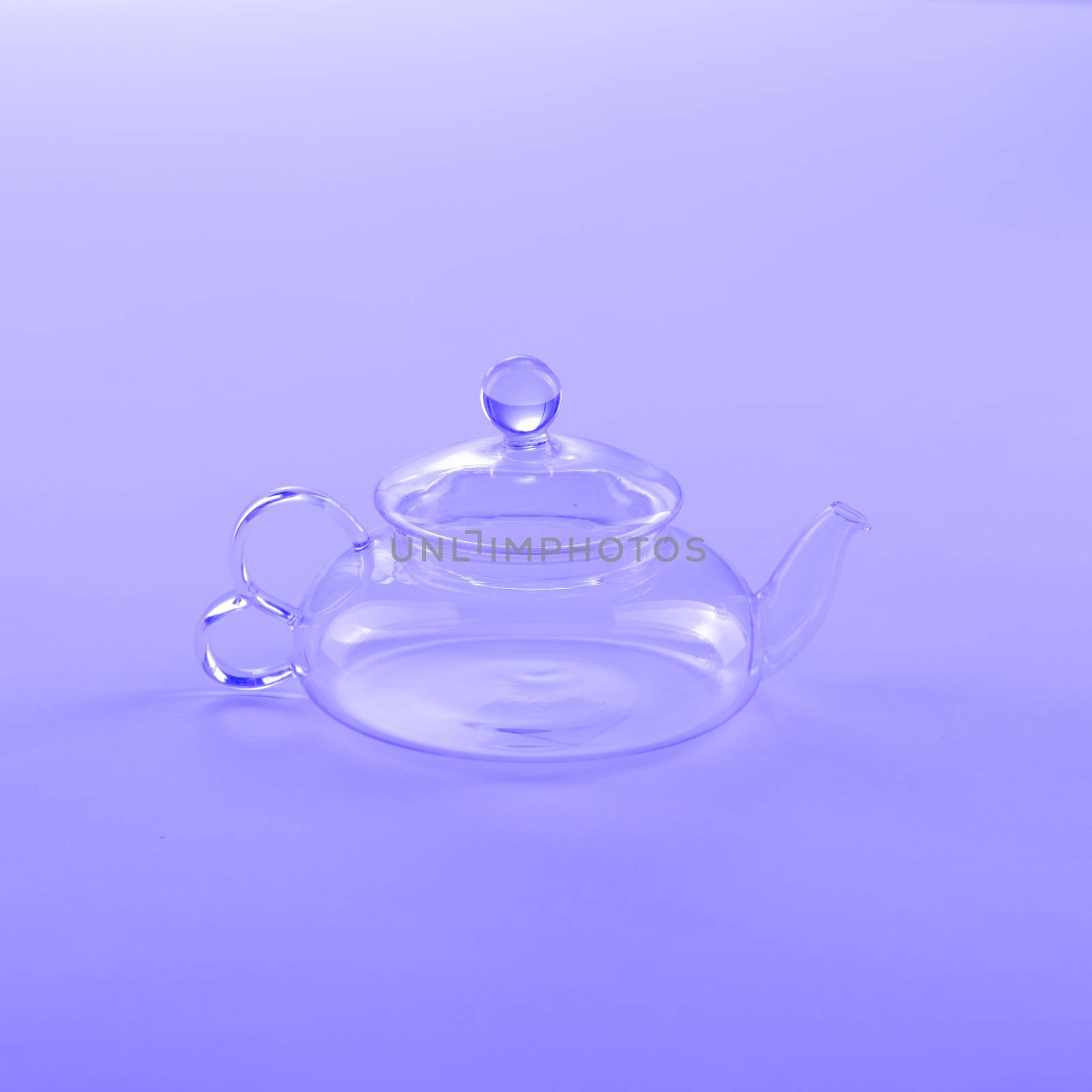 Isolated Tea Pot from glass on the table