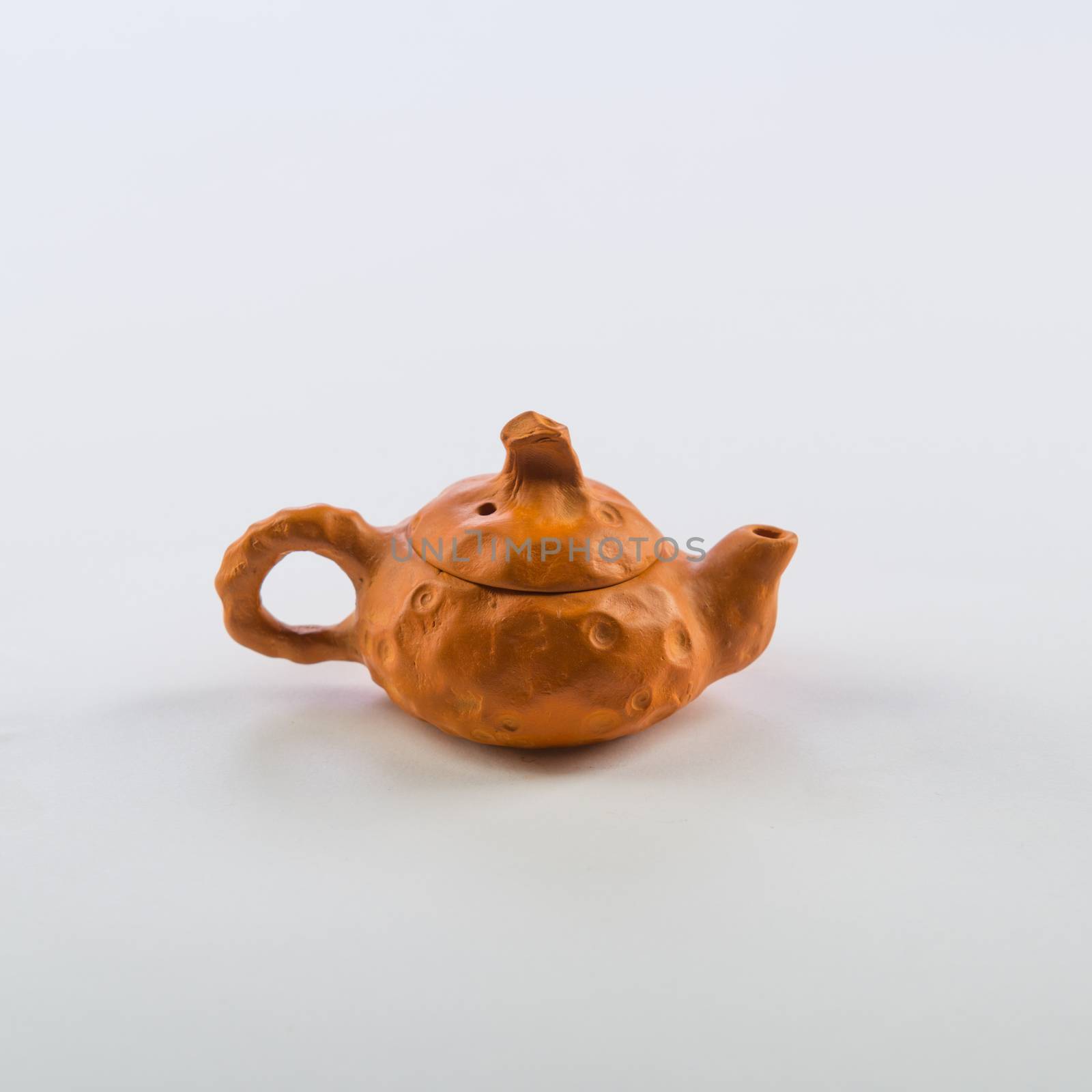 Isolated Tea Pot from glass on the table