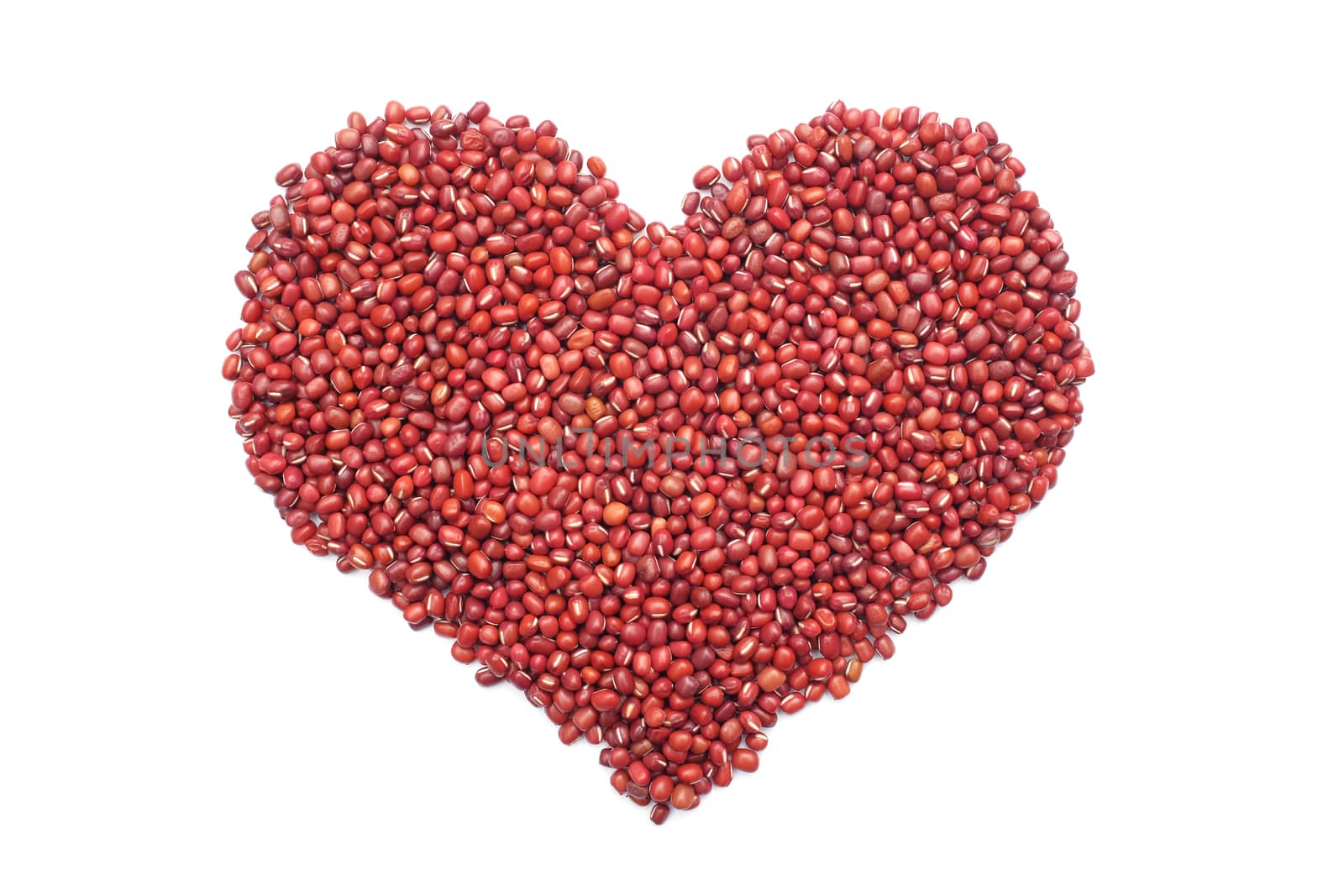 Red adzuki beans in a heart shape, isolated on a white background