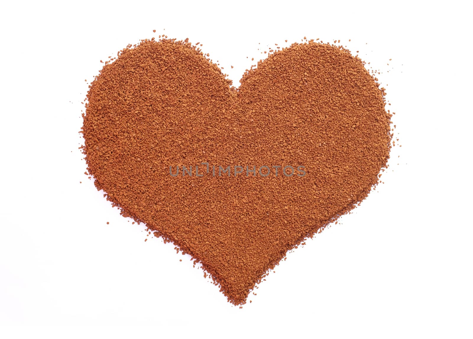 Instant coffee granules in a heart shape, isolated on a white background