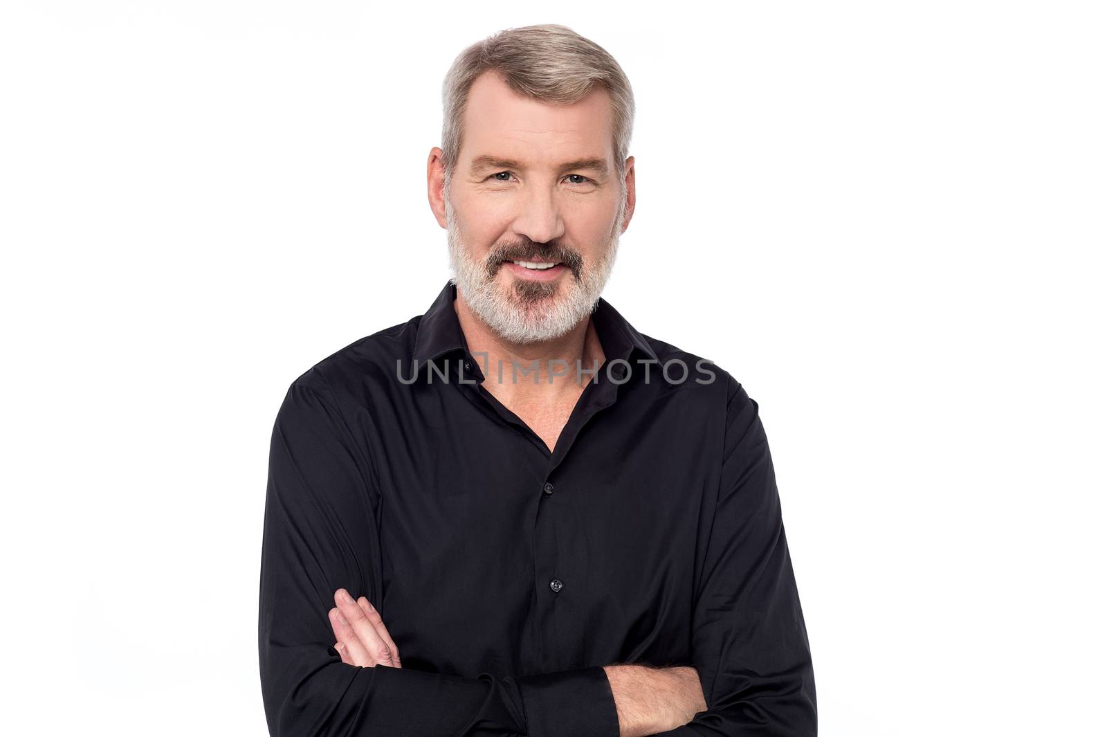 Handsome mature man posing with folded arms