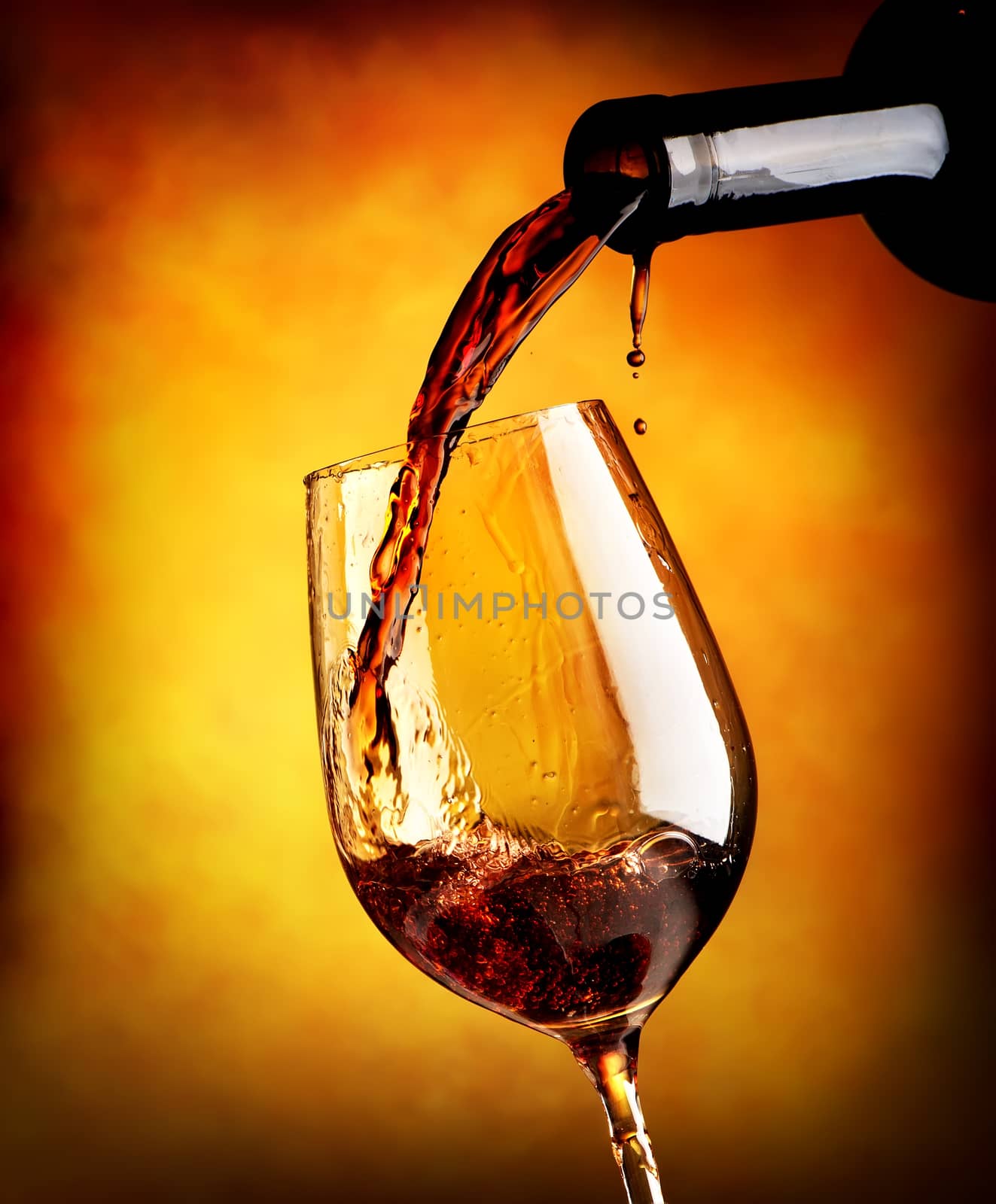 Red wine on orange background by Givaga