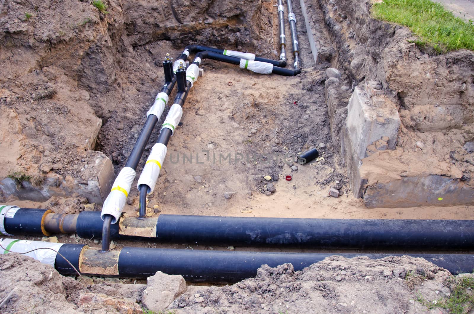  plastic modern technology black heating pipes in trench near city house