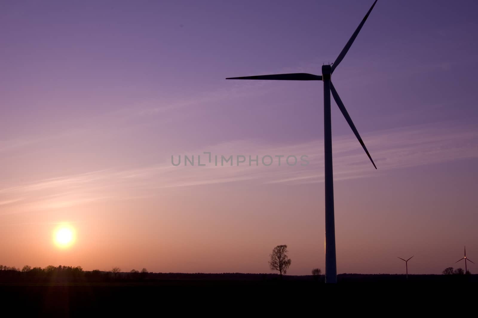 Windmill conceptual image. Windmill in sundown.