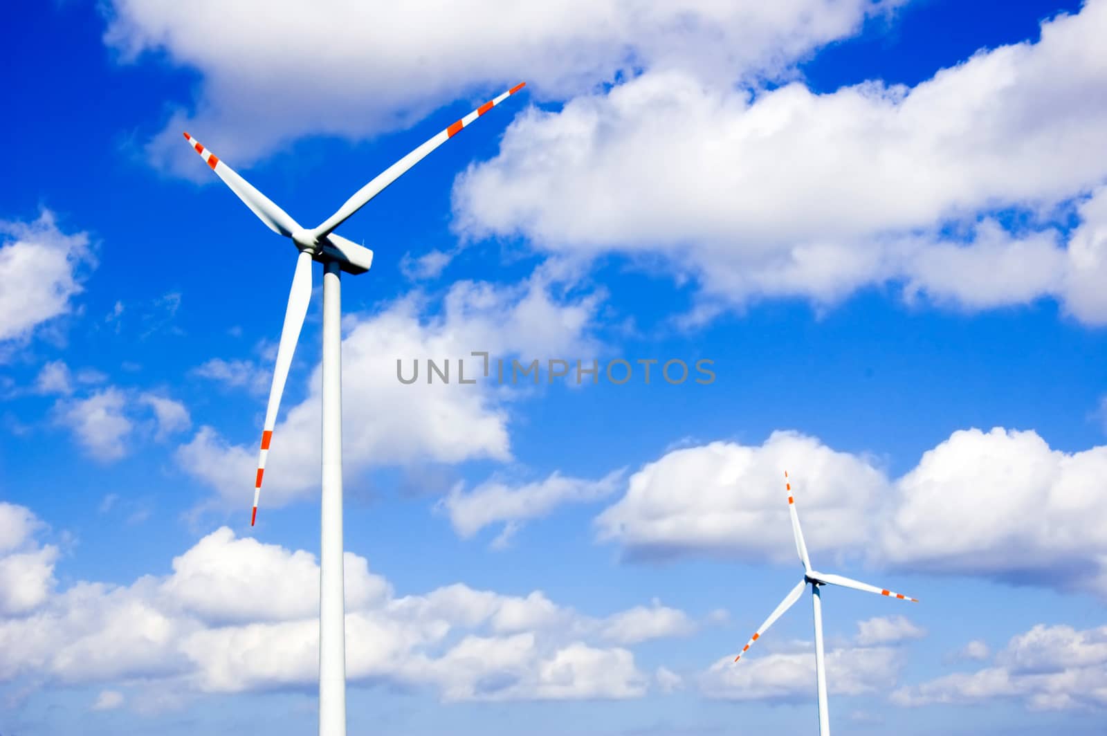 Windmill conceptual image. Windmills against the blue sky.