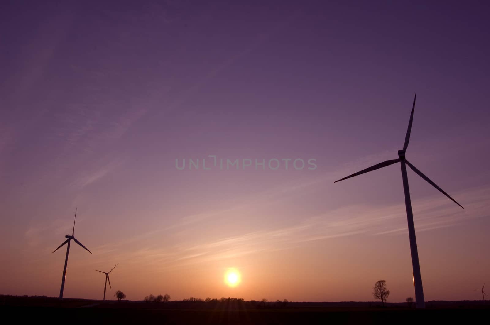 Windmill conceptual image. Windmills in sundown.