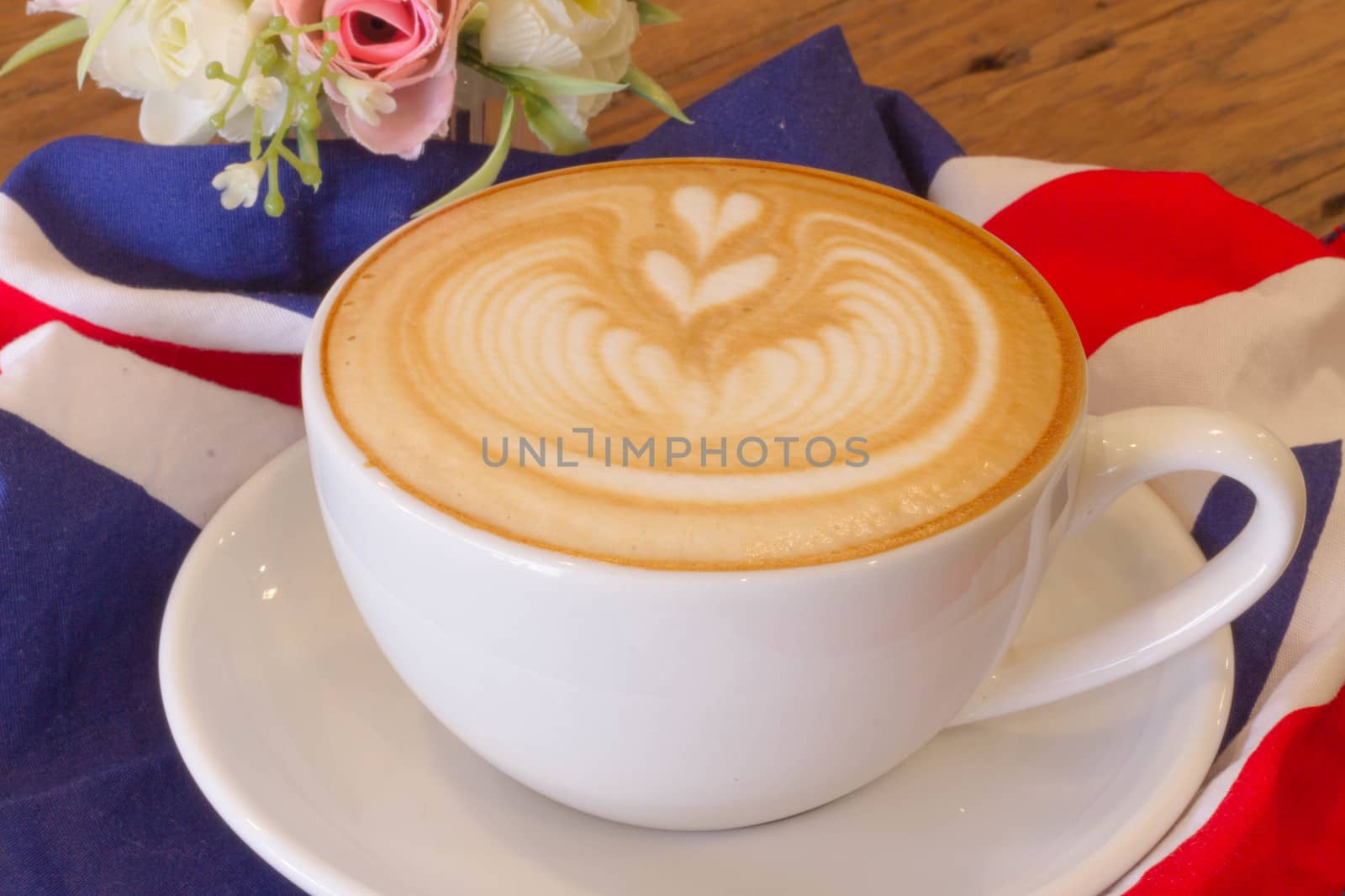 Coffee latte art on the wood desk