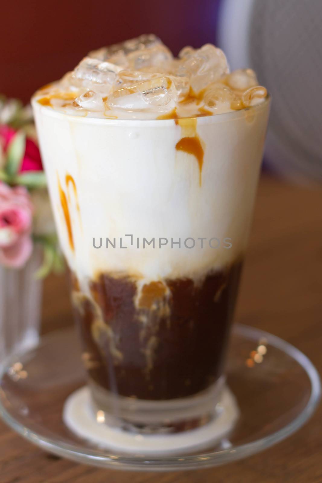 Ice Coffee with milk on the wood desk