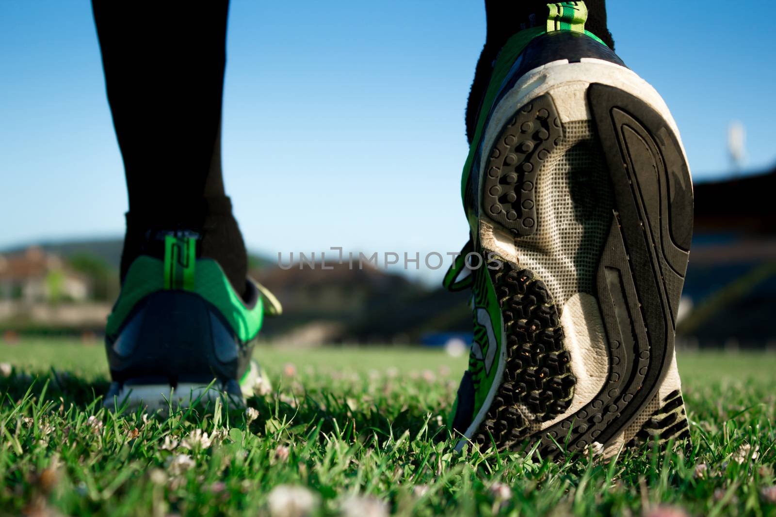 Runner preparing to train on a stadium