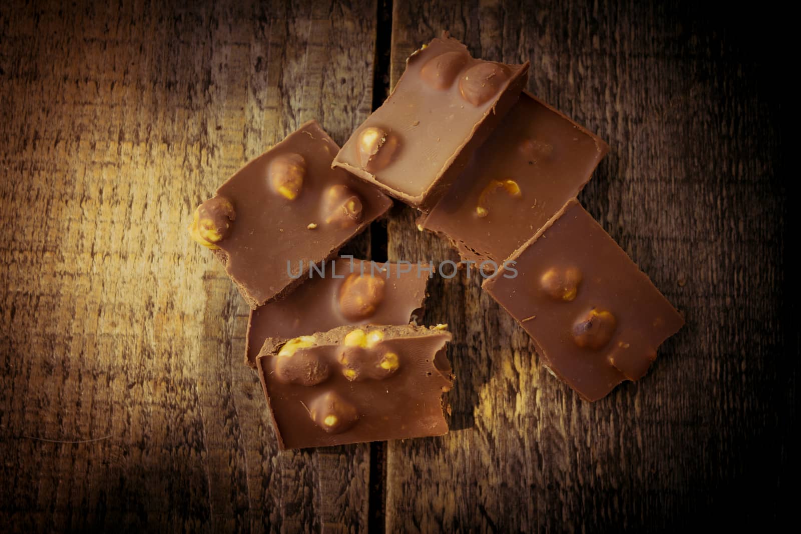 Chocolate pieces on a wooden table