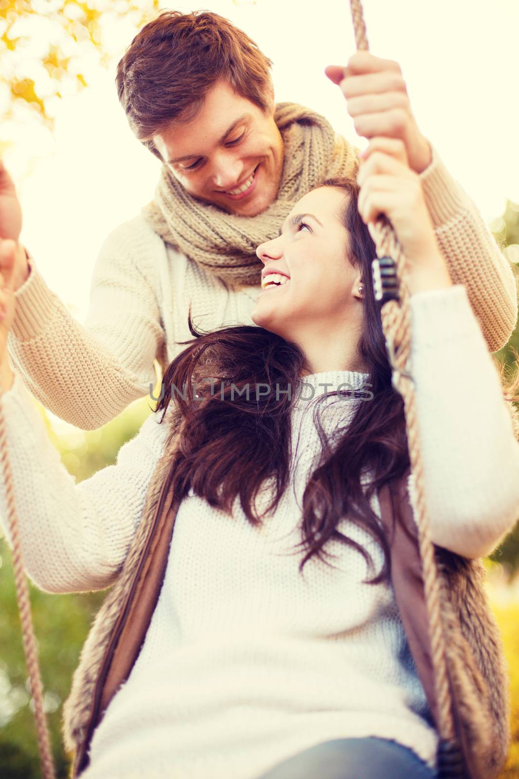 romantic couple in the autumn park by dolgachov