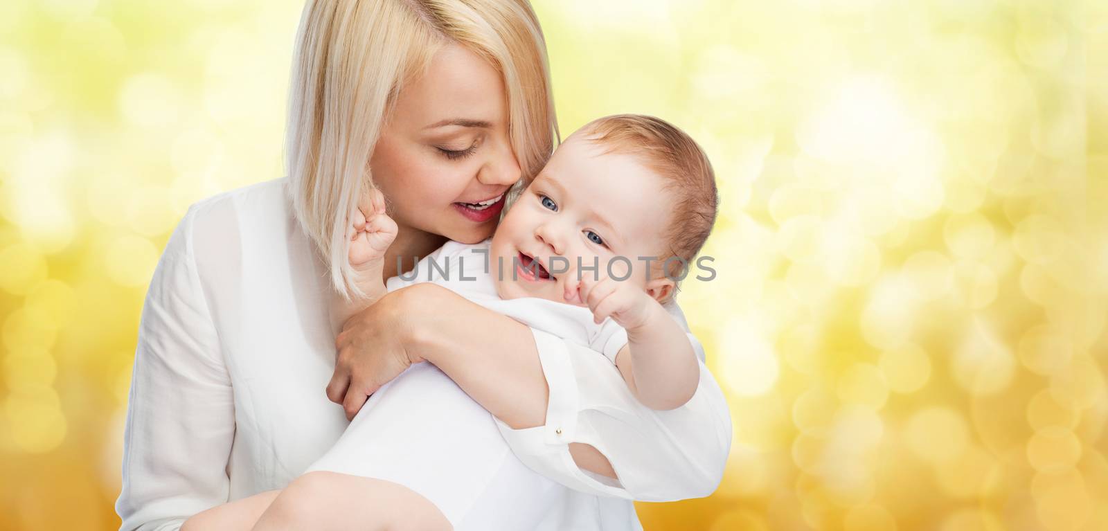 happy mother with smiling baby by dolgachov