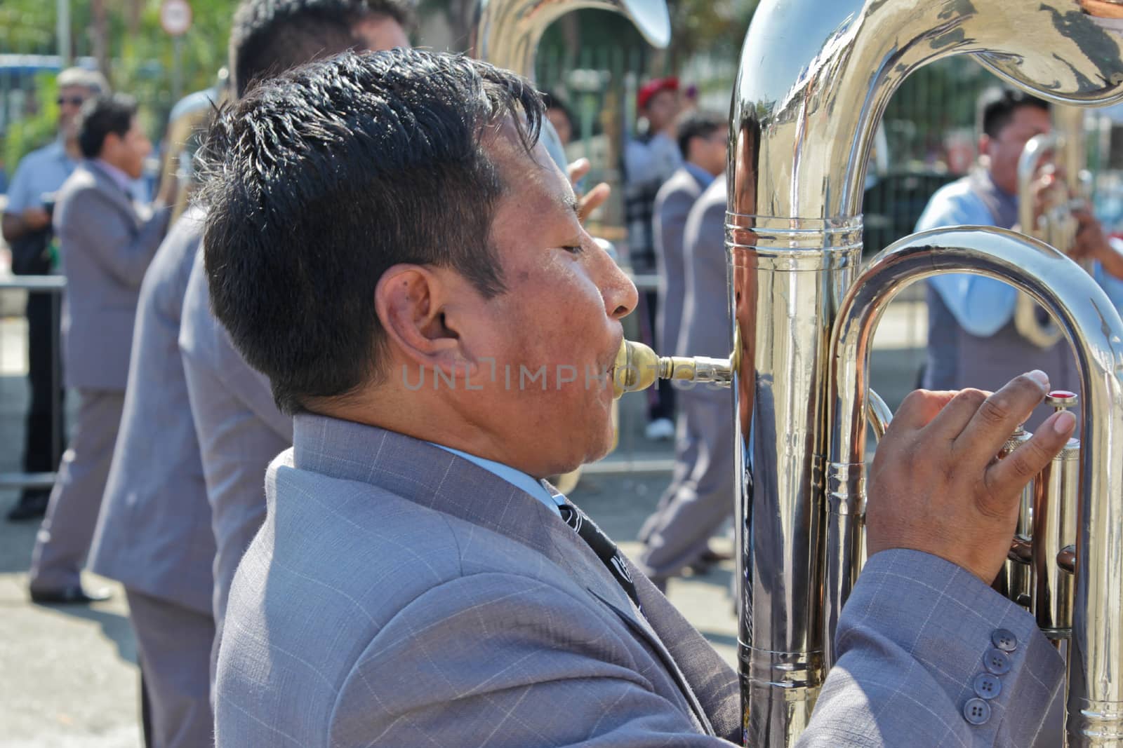 SAO PAULO, BRAZIL August 9 2015: An unidentified man with typical costumes playing a typical music instrument during the Morenada parade in Bolivian Independence Day celebration in Sao Paulo Brazil.