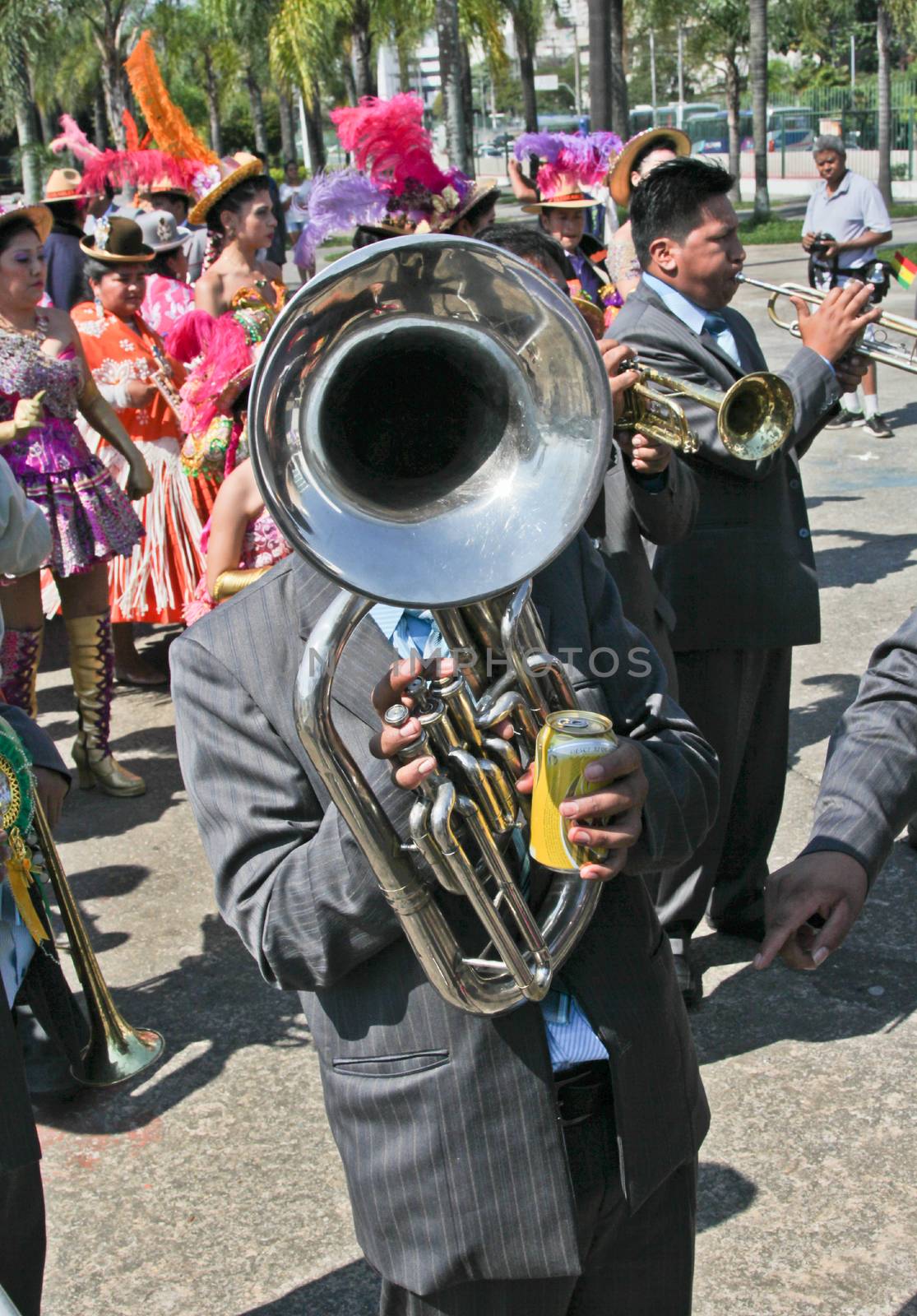 SAO PAULO, BRAZIL August 9 2015: An unidentified man with typical costumes playing a typical music instrument during the Morenada parade in Bolivian Independence Day celebration in Sao Paulo Brazil.