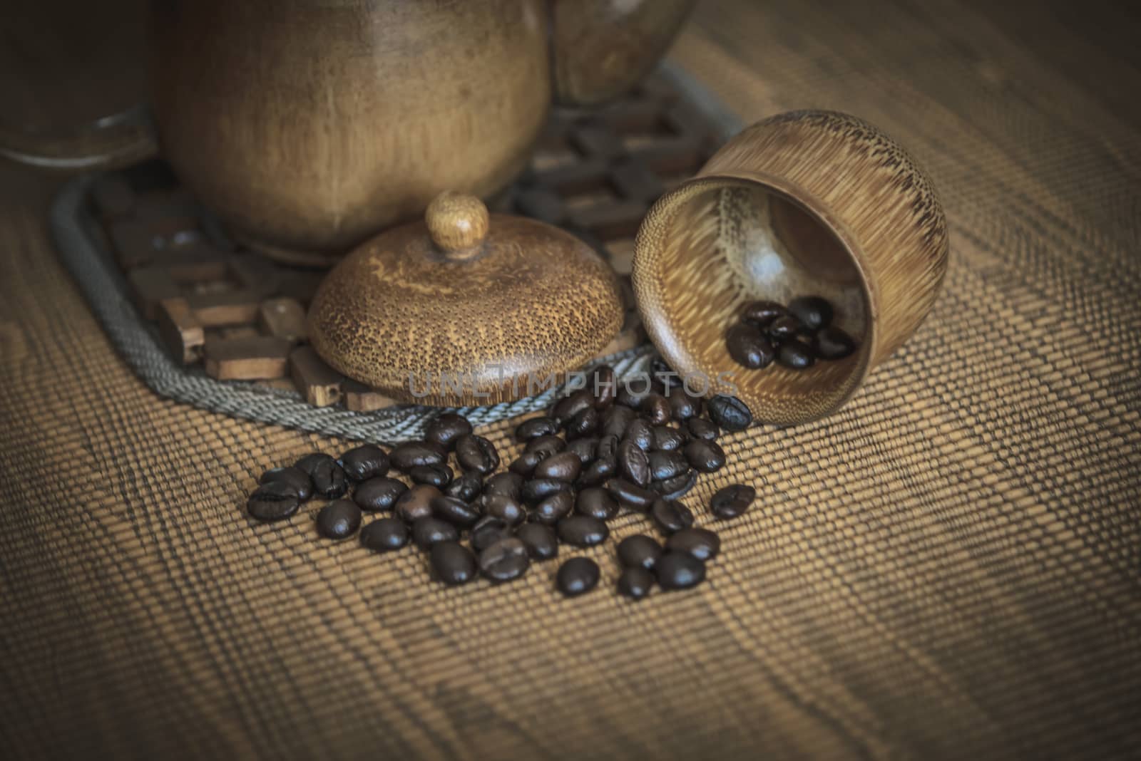 Vintage photo of coffee beans and Coffee cups set on wooden background.Vintage style.