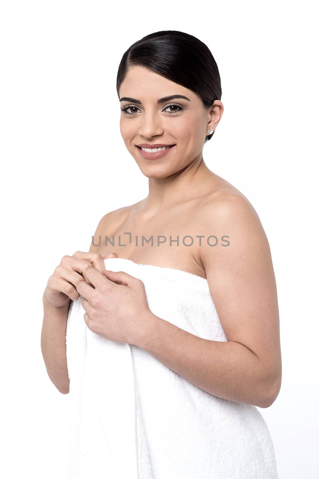 Beautiful woman wrapped towel for bath over white