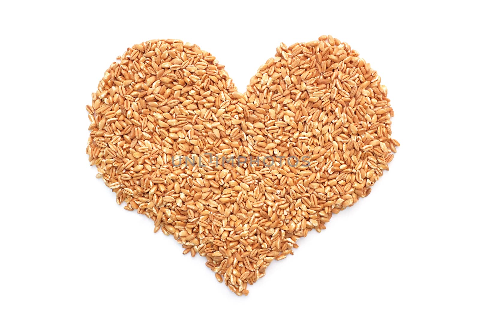 Farro dicocco in a heart shape, isolated on a white background