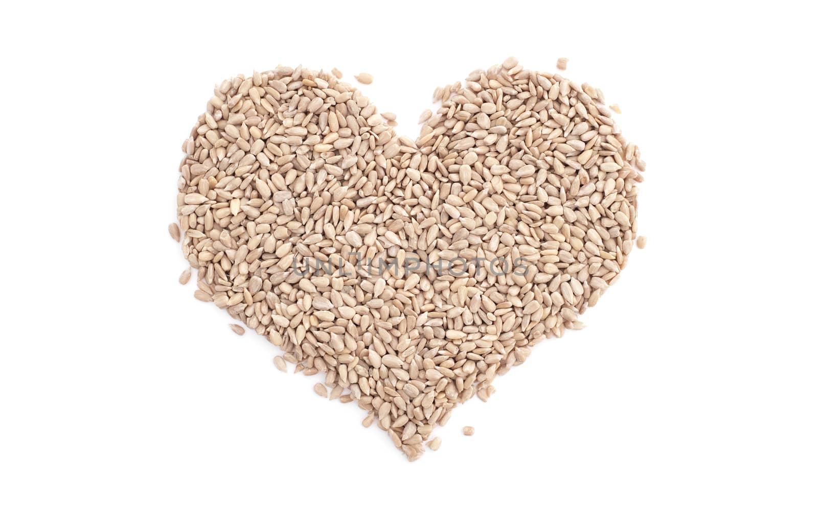 Sunflower hearts in a heart shape, isolated on a white background
