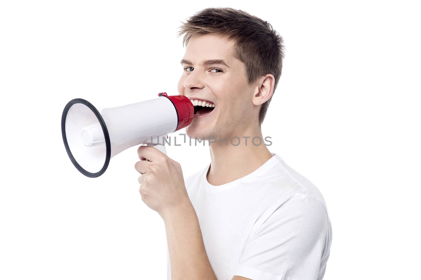Young man proclaiming into megaphone