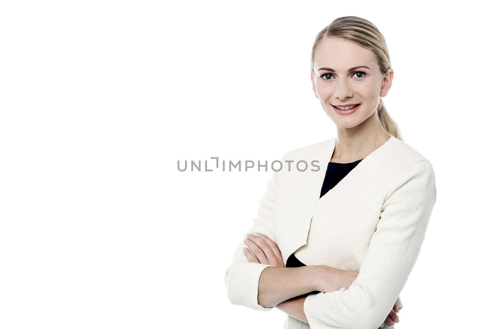 Stylish young woman posing with crossed arms