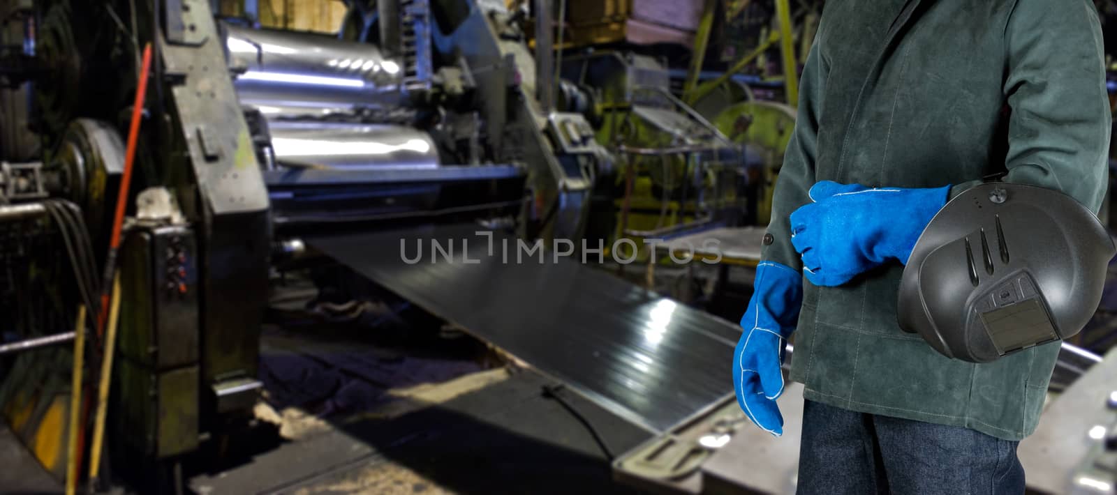 Worker with instruments at industrial factory