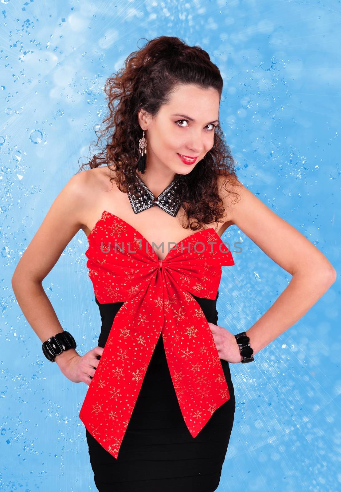 brunette in a black dress with a big red bow