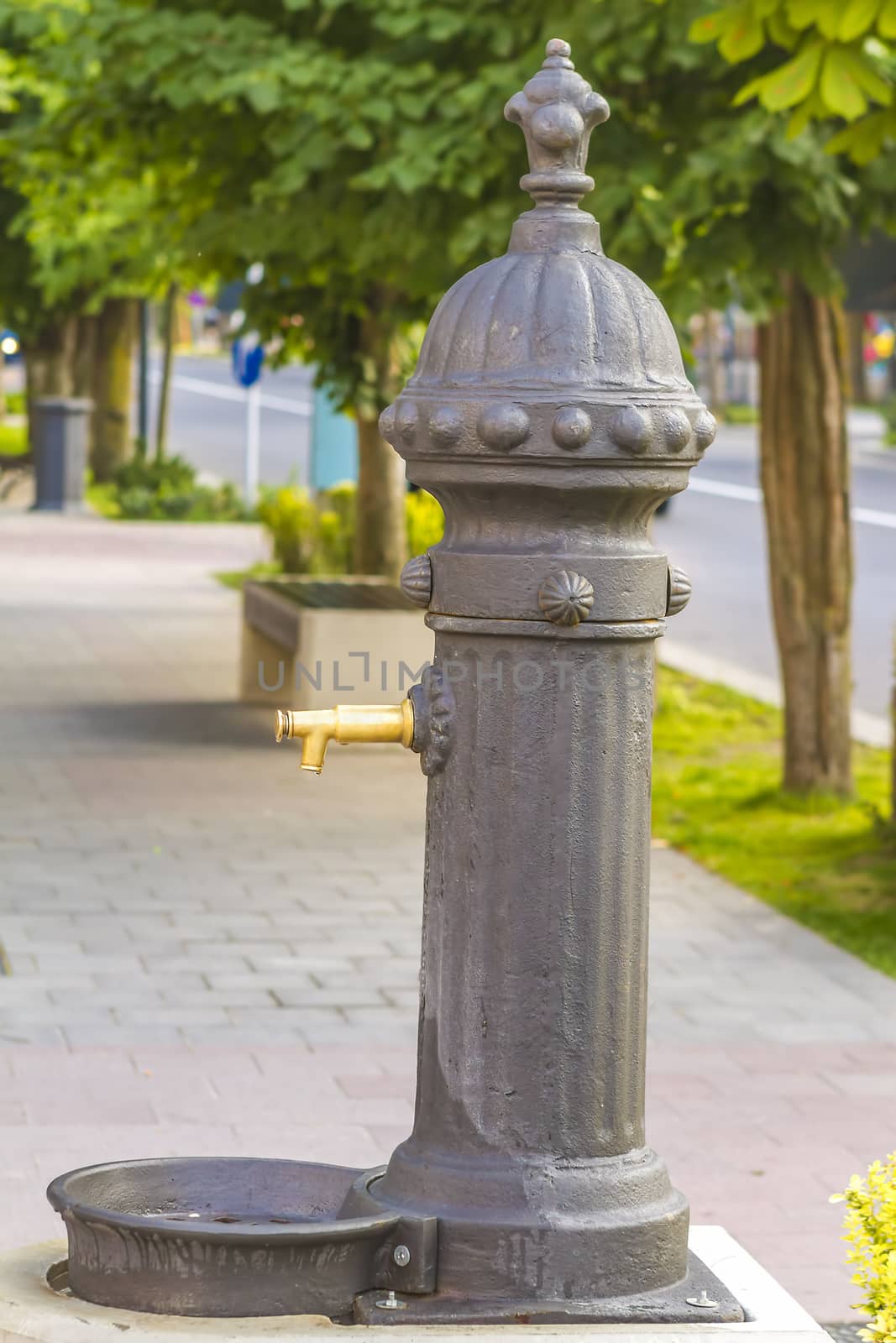 Traditional drinking water fountain with water drop by manaemedia