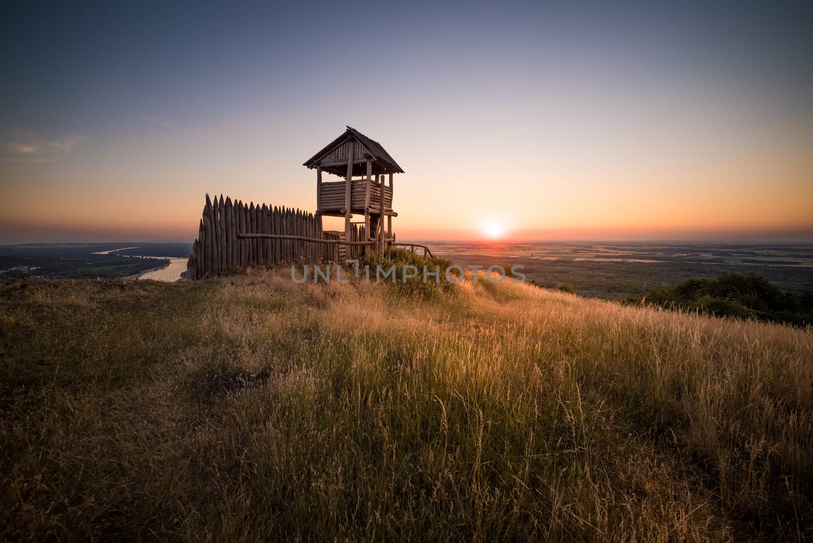 Wooden Tourist Observation Tower over a Landscape at Beautiful Sunset