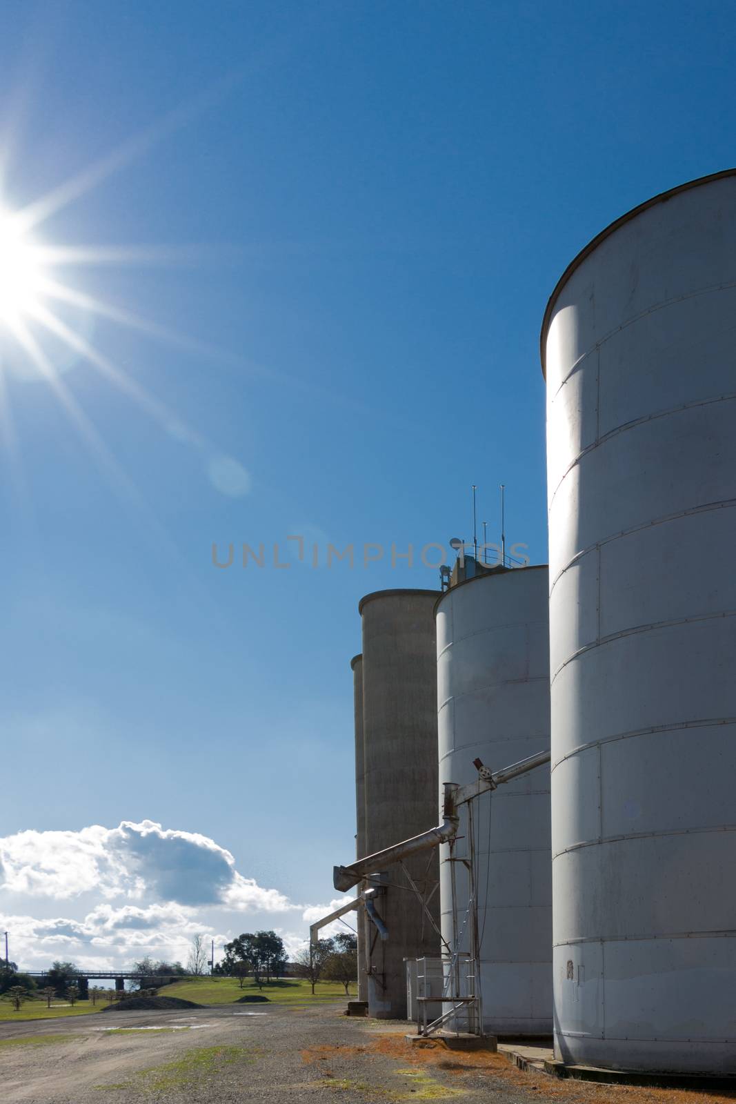 Large silos on a clear day.