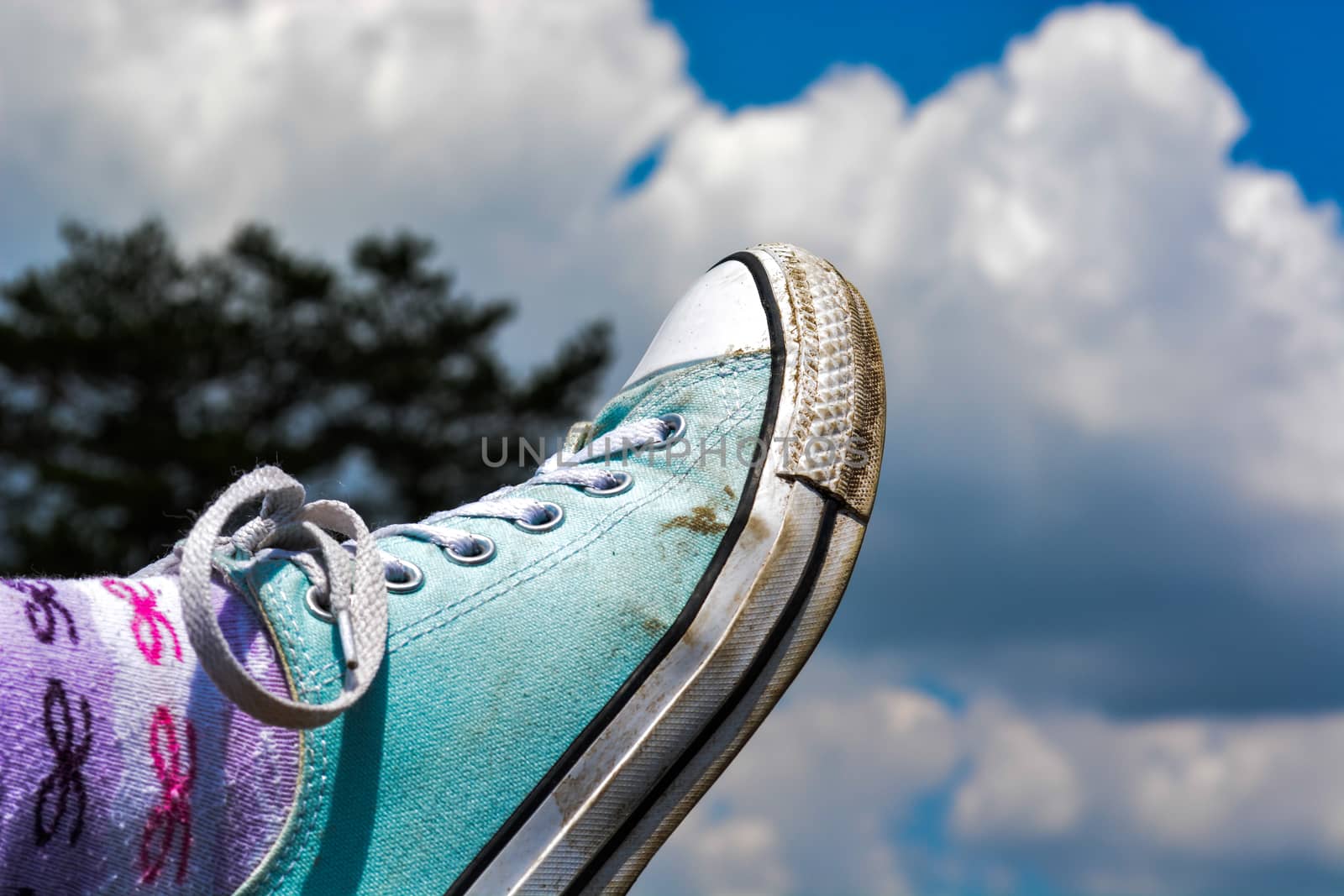 Shoe and the clouds in the background