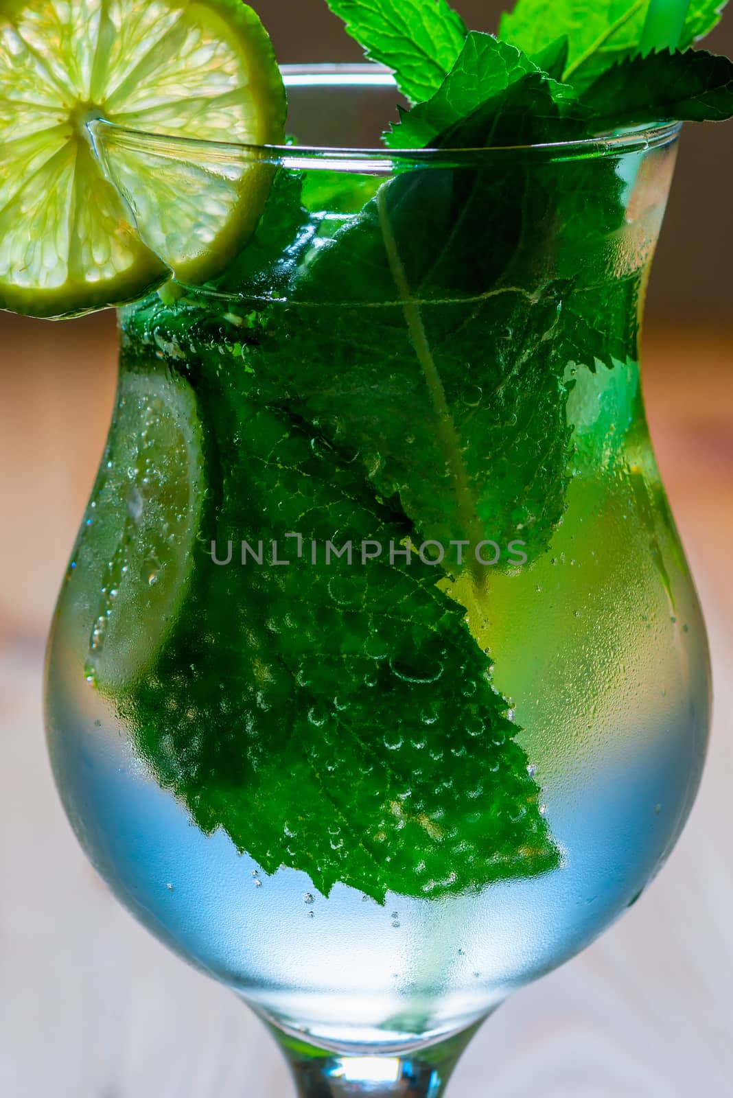 air bubbles in the mint leaves in the mojito cocktail by kosmsos111