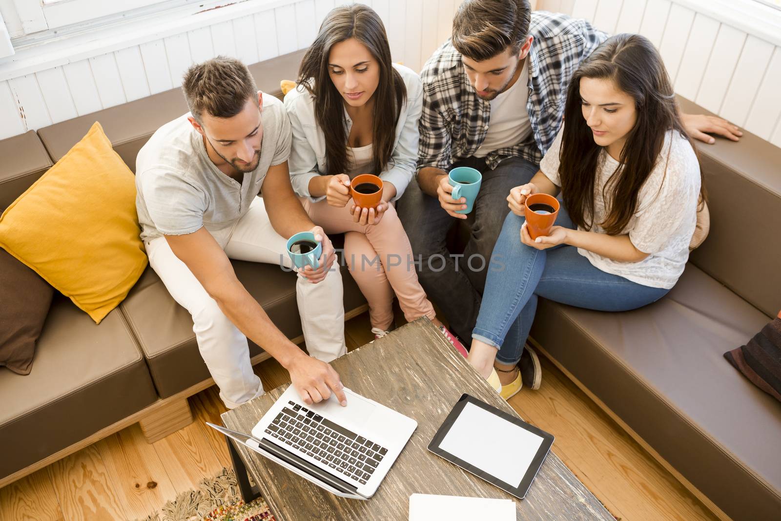 Group of friends at local Coffee Shop studying