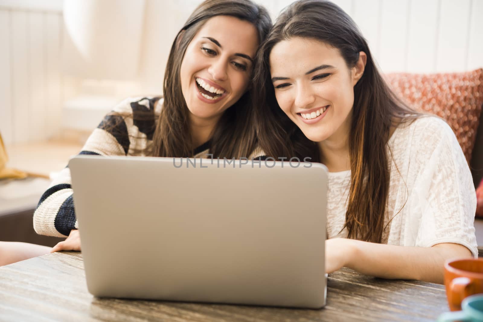 Female friends studying at the local coffee shop