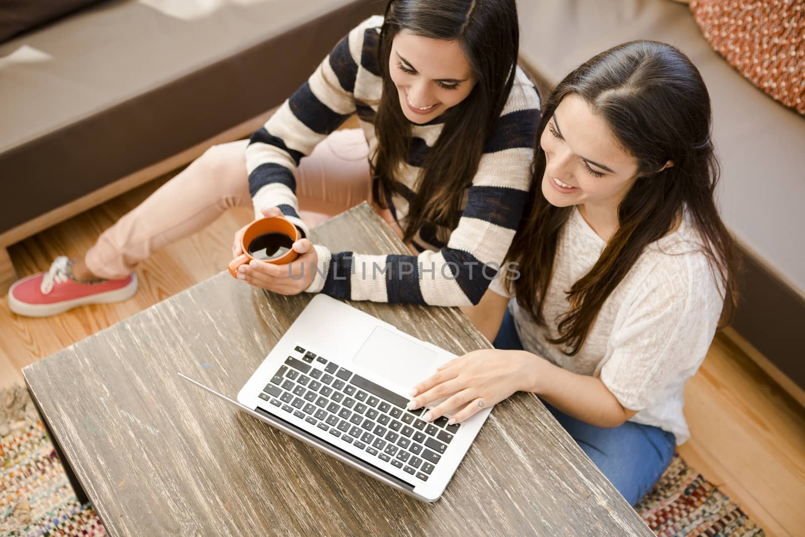 Female friends studying at the local coffee shop