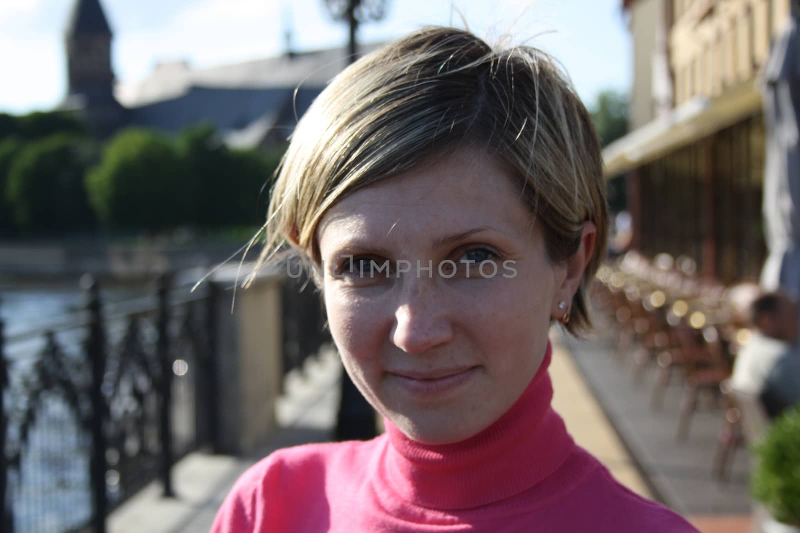 portrait  cheerful woman on the background of  river by alexx60