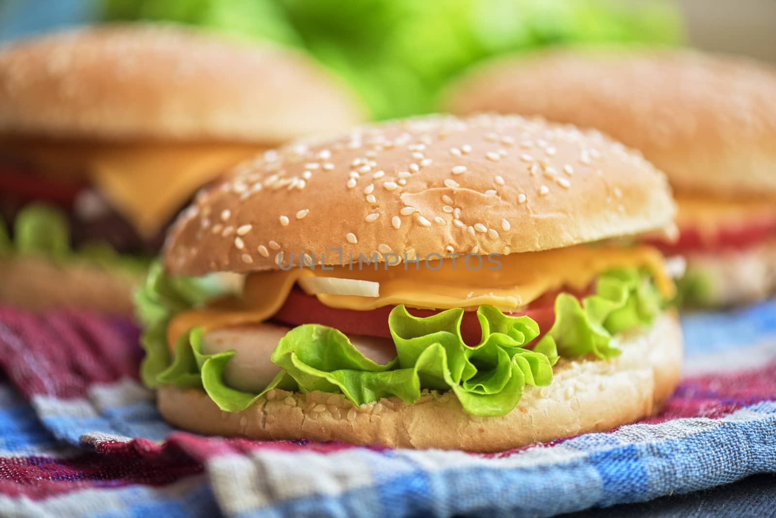 Closeup of home made burgers on wooden table